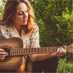Female playing Guitar
