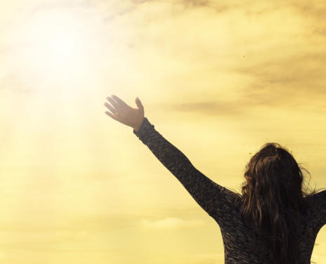 lady reaching to sky